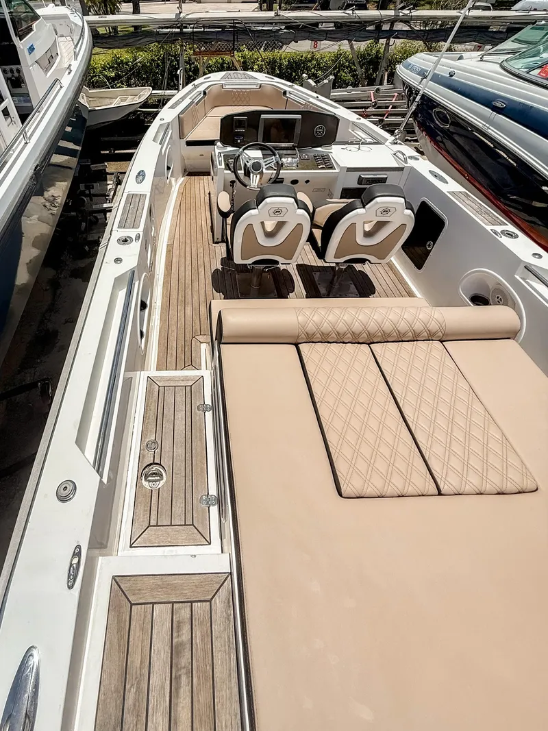 Slide: The Image of 2011 Novurania Chase 23 boat with luxurious seating and sleek design. - 7