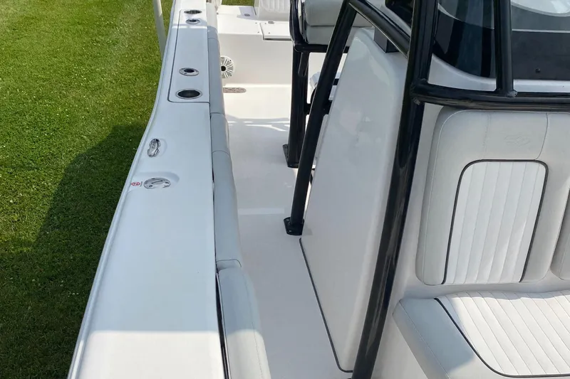 Slide: The Image of 2020 Sea Fox Commander 248 boat interior with white seating and black frame. - 10