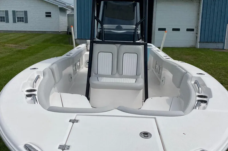 Slide: The Image of 2020 Sea Fox Commander 248 boat interior with white seating and center console. - 11