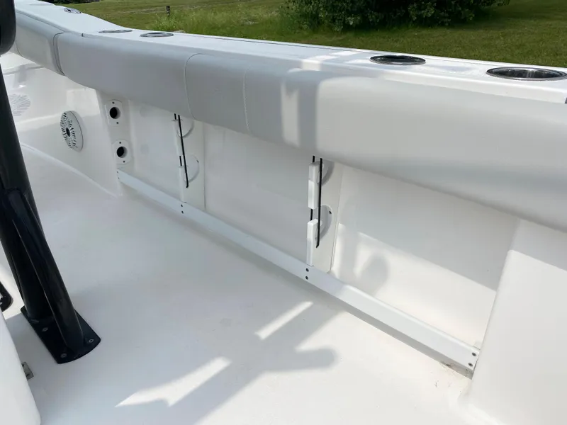 Slide: The Image of 2020 Sea Fox Commander 248 boat interior with cushioned seating and storage compartments. - 13