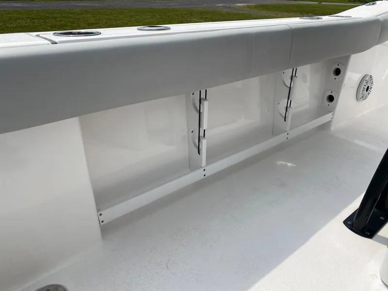 Slide: The Image of 2020 Sea Fox Commander 248 boat interior, white side panel with storage compartments. - 14