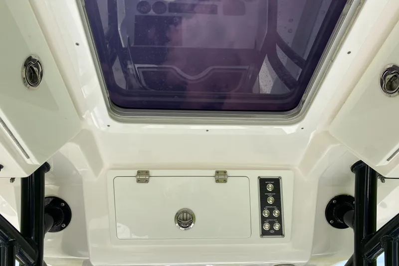 Slide: The Image of 2020 Sea Fox Commander 248 boat console with overhead storage and control panel. - 21