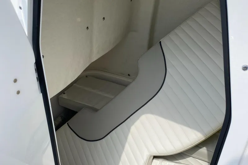 Slide: The Image of 2020 Sea Fox Commander 248 cabin interior with white cushioned seating. - 22