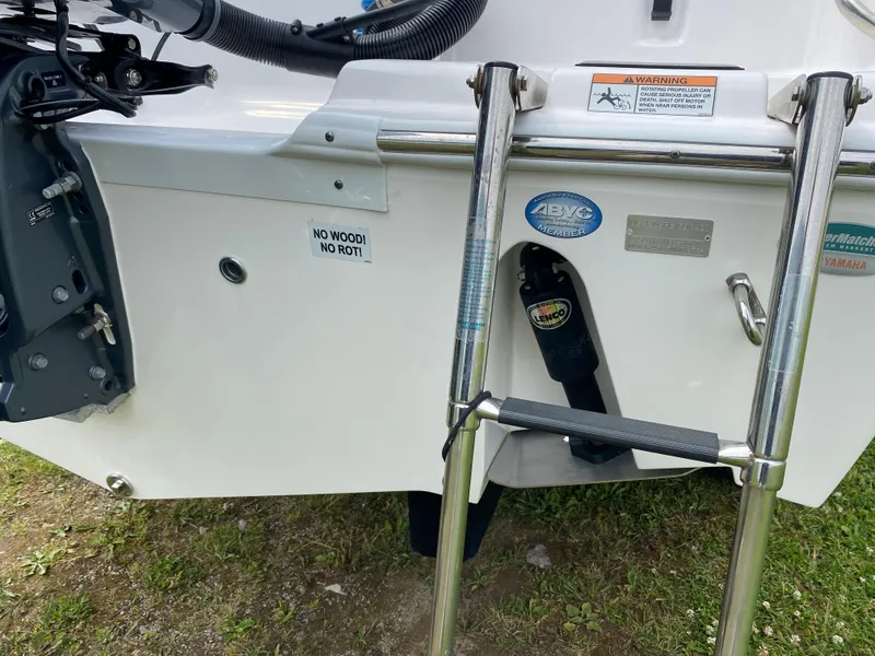 Slide: The Image of 2020 Sea Fox Commander 248 boat stern with ladder and engine components. - 23