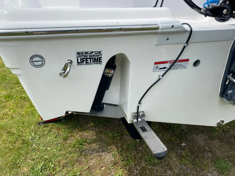 Slide: The Image of 2020 Sea Fox Commander 248 boat stern with lifetime warranty sticker. - 24