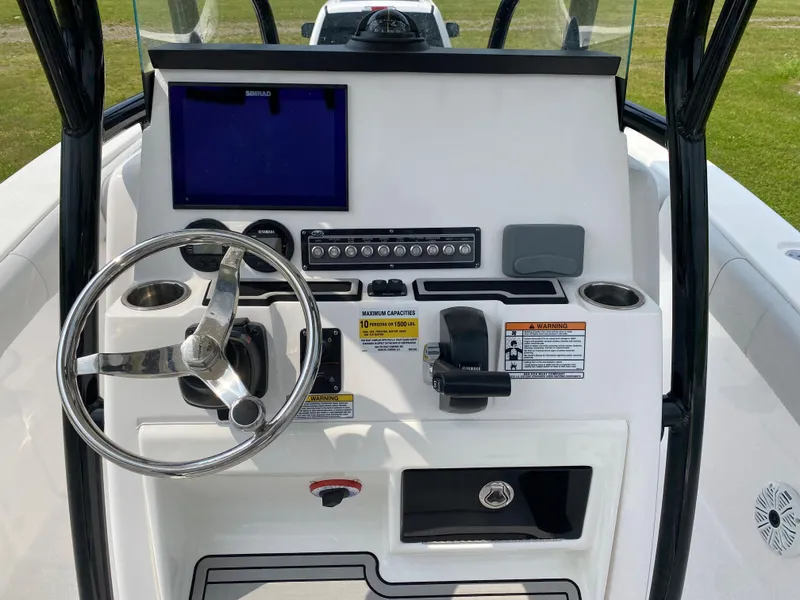 Slide: The Image of 2020 Sea Fox Commander 248 boat console with steering wheel and navigation controls. - 6