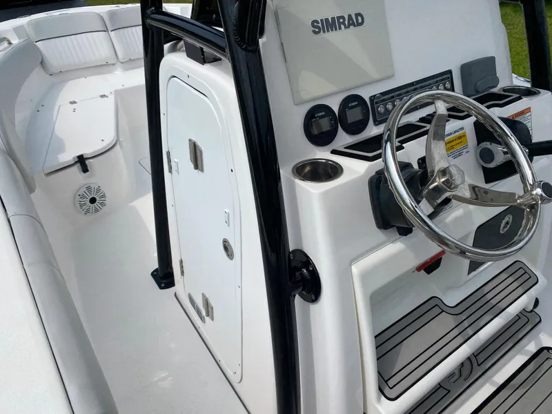 Slide: The Image of 2020 Sea Fox Commander 248 boat console with Simrad electronics and steering wheel. - 7