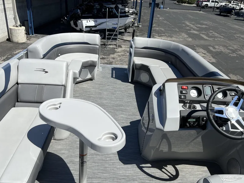 Slide: The Image of 2022 Bennington 21 SXRF pontoon boat interior with seating and helm. - 10