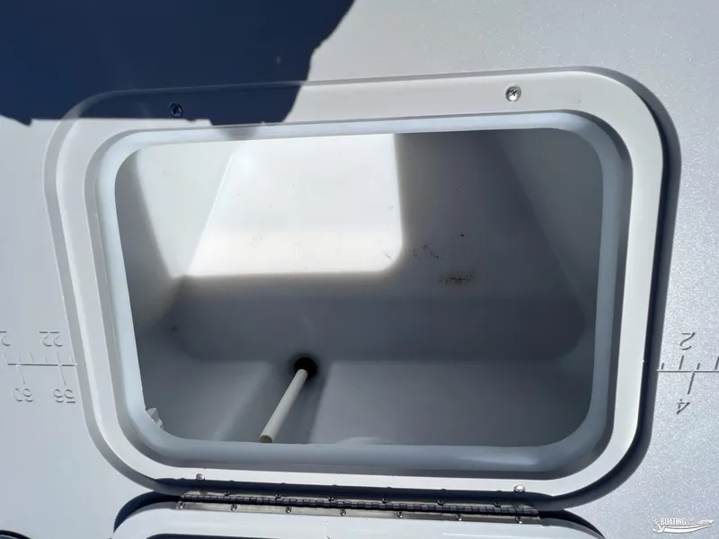 Slide: The Image of Open storage compartment on 2022 Bennington 21 SXRF boat. - 11