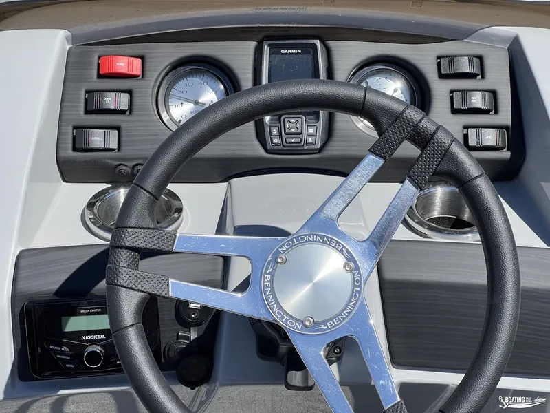 Slide: The Image of 2022 Bennington 21 SXRF boat dashboard with steering wheel and control panel. - 4