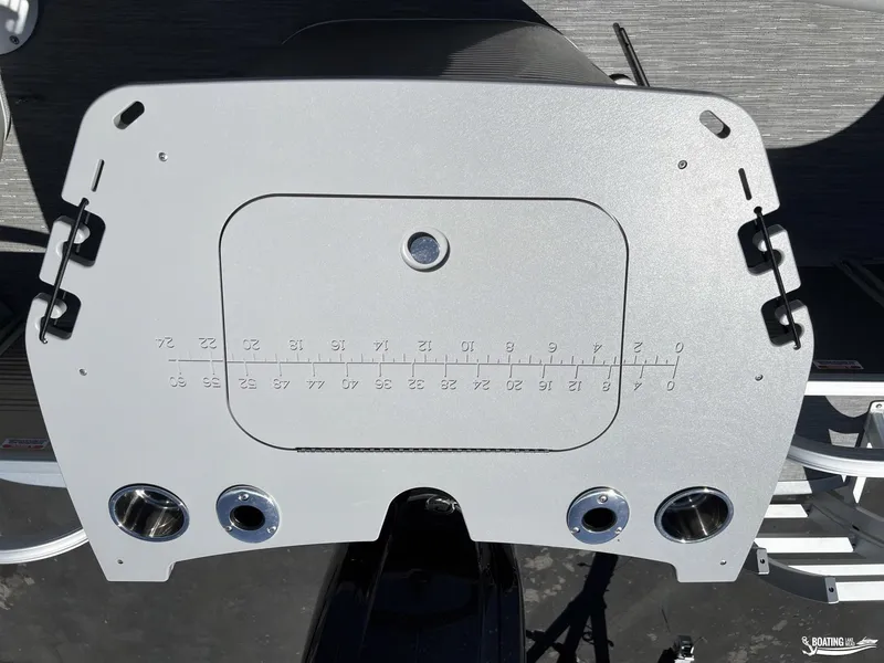 Slide: The Image of 2022 Bennington 21 SXRF boat dashboard with cup holders and measurement markings. - 8