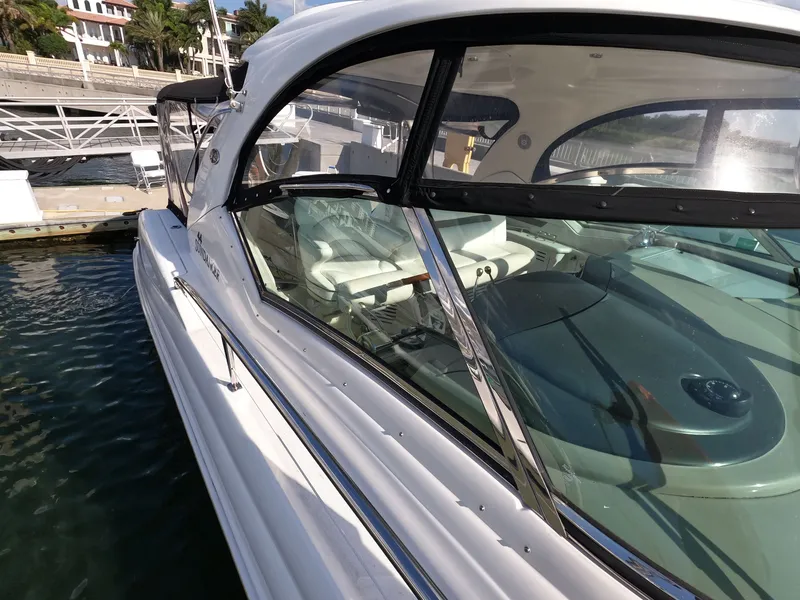 Slide: The Image of 2007 Sea Ray 44 Sundancer yacht docked at marina, showcasing sleek design and luxurious interior. - 15