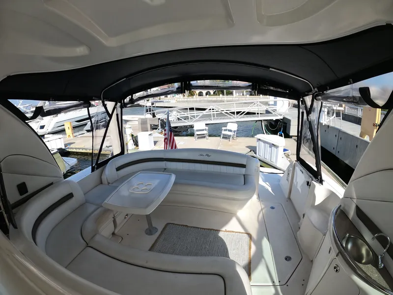 Slide: The Image of 2007 Sea Ray 44 Sundancer yacht interior with seating and table at marina. - 18