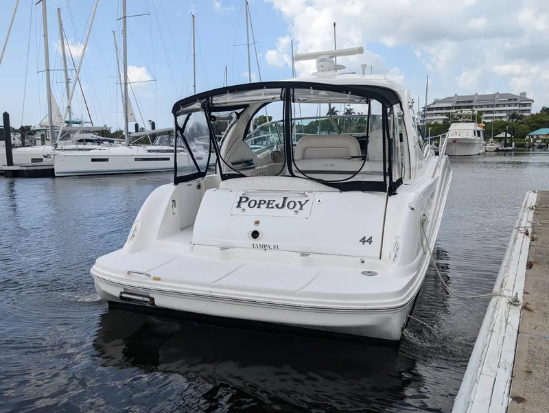Slide: The Image of 2007 Sea Ray 44 Sundancer yacht docked in marina, rear view. - 2