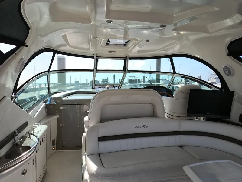 Slide: The Image of Interior of 2007 Sea Ray 44 Sundancer yacht with luxurious seating and modern amenities. - 24
