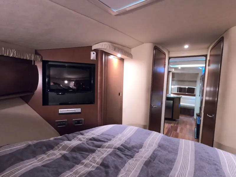 Slide: The Image of Interior cabin of 2007 Sea Ray 44 Sundancer yacht with TV and bed. - 45