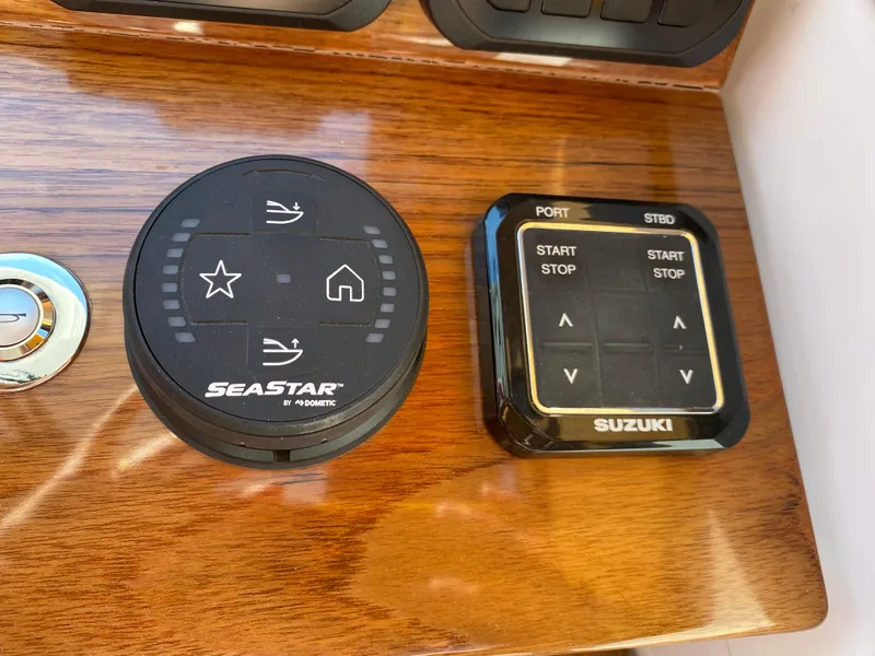 Slide: The Image of Control panel of 2023 True North 34 Outboard Express with SeaStar and Suzuki systems. - 26