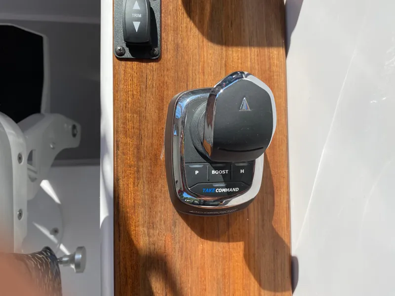 Slide: The Image of Control panel of 2023 True North 34 Outboard Express boat with trim and boost features. - 29