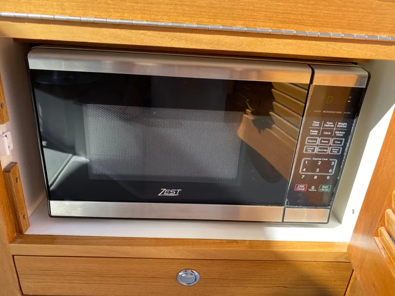 Slide: The Image of Microwave oven in 2023 True North 34 Outboard Express boat kitchen. - 48