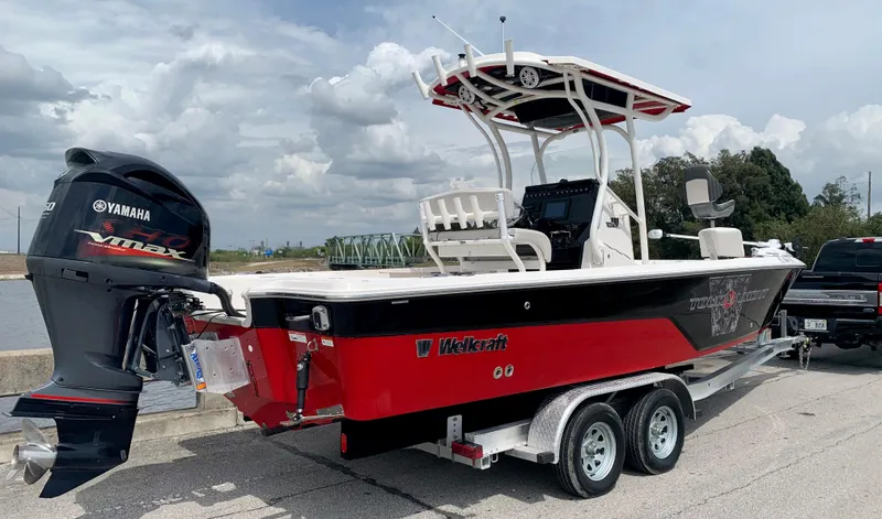 Slide: The Image of 2019 Wellcraft 241 Bay boat on trailer with Yamaha VMAX outboard motor. - 10