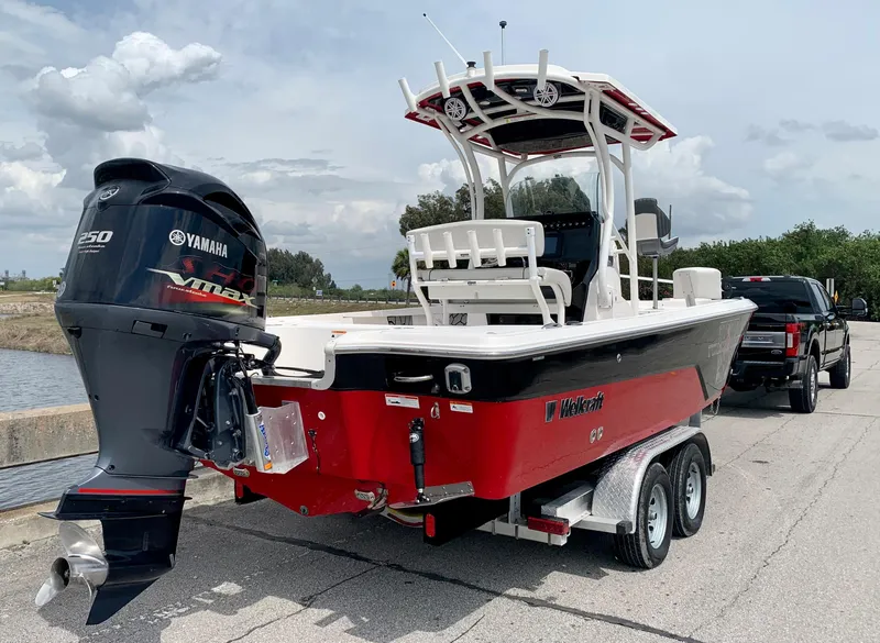 Slide: The Image of 2019 Wellcraft 241 Bay boat with Yamaha 250 engine on trailer. - 11