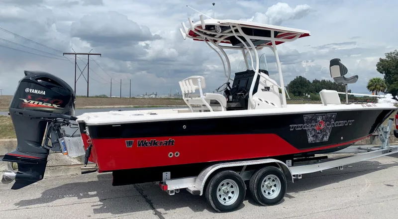 Slide: The Image of 2019 Wellcraft 241 Bay boat on trailer with Yamaha outboard motor. - 12
