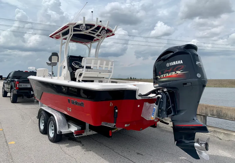 Slide: The Image of 2019 Wellcraft 241 Bay boat with Yamaha outboard motor on trailer. - 14