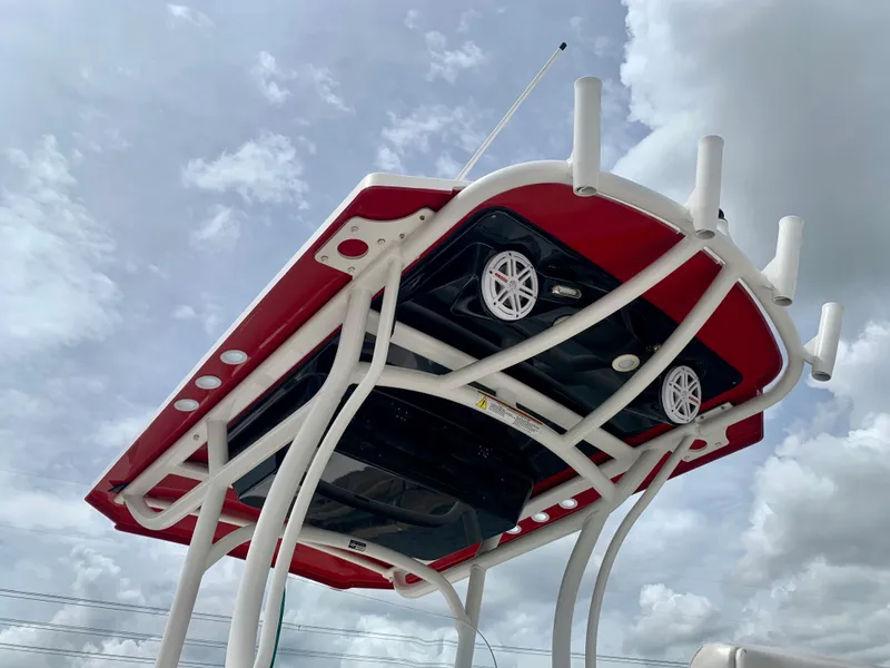 Slide: The Image of 2019 Wellcraft 241 Bay boat T-top with rod holders and speakers. - 22