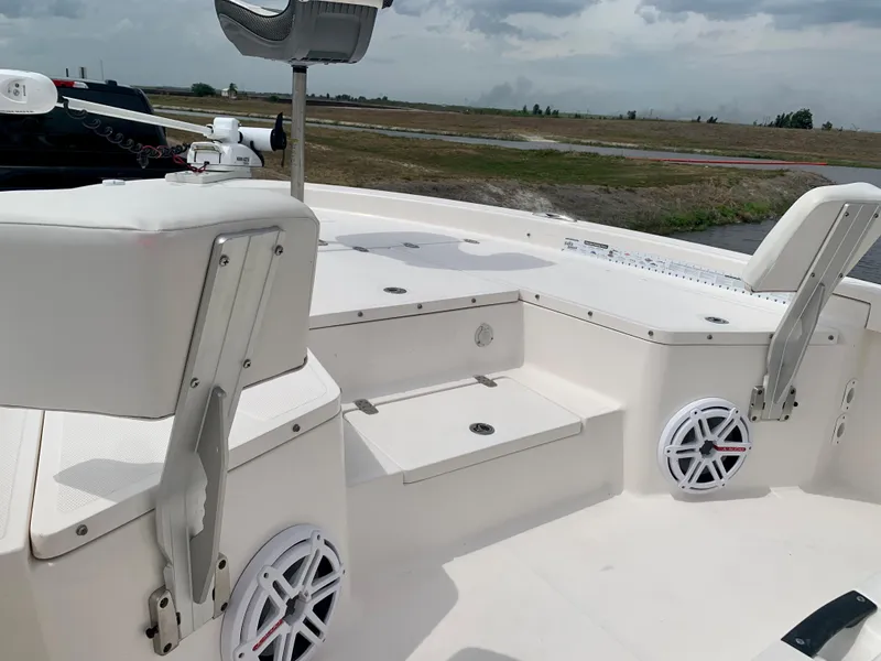 Slide: The Image of 2019 Wellcraft 241 Bay boat interior with seating and speakers. - 23