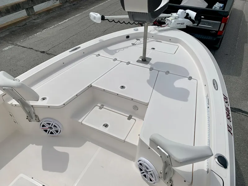 Slide: The Image of 2019 Wellcraft 241 Bay boat deck with storage compartments and seating. - 28