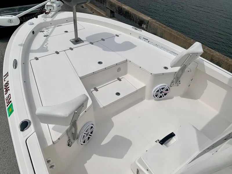 Slide: The Image of 2019 Wellcraft 241 Bay boat interior with seating and storage compartments. - 29