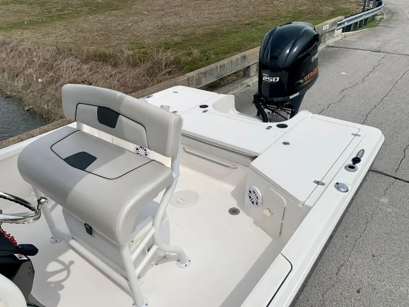 Slide: The Image of 2019 Wellcraft 241 Bay boat with seating and outboard motor. - 30