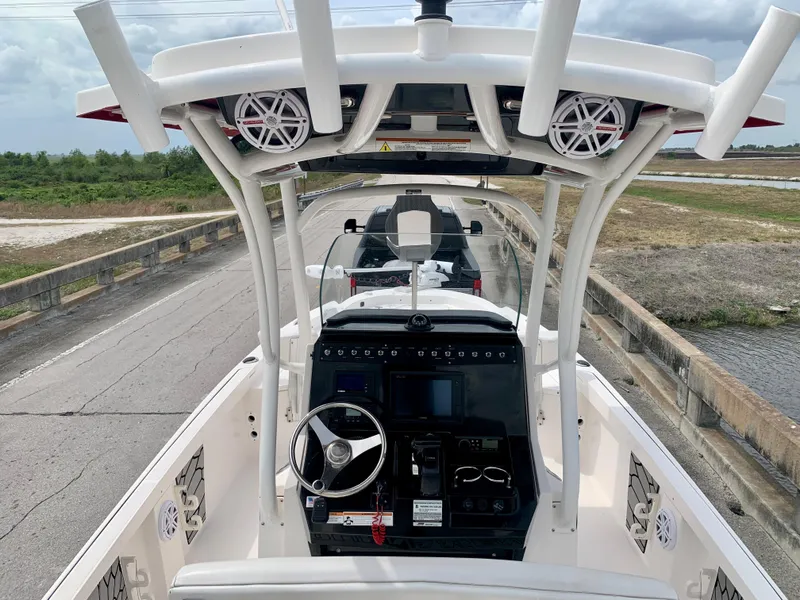 Slide: The Image of 2019 Wellcraft 241 Bay boat console with steering wheel and electronics. - 31