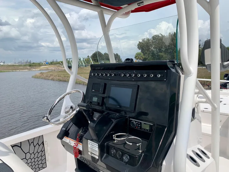 Slide: The Image of 2019 Wellcraft 241 Bay boat console with steering wheel and navigation system. - 34