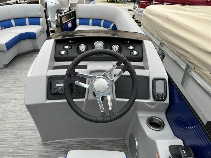 Slide: The Image of 2021 Bennington 22 SSLXP boat dashboard with steering wheel and control panel. - 12