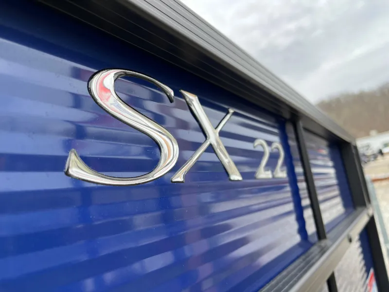 Slide: The Image of Close-up of 2021 Bennington 22 SSLXP boat model emblem. - 2