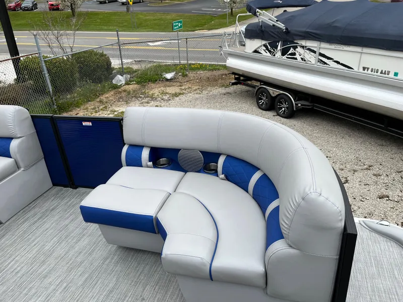 Slide: The Image of 2021 Bennington 22 SSLXP pontoon boat with blue and gray seating. - 4