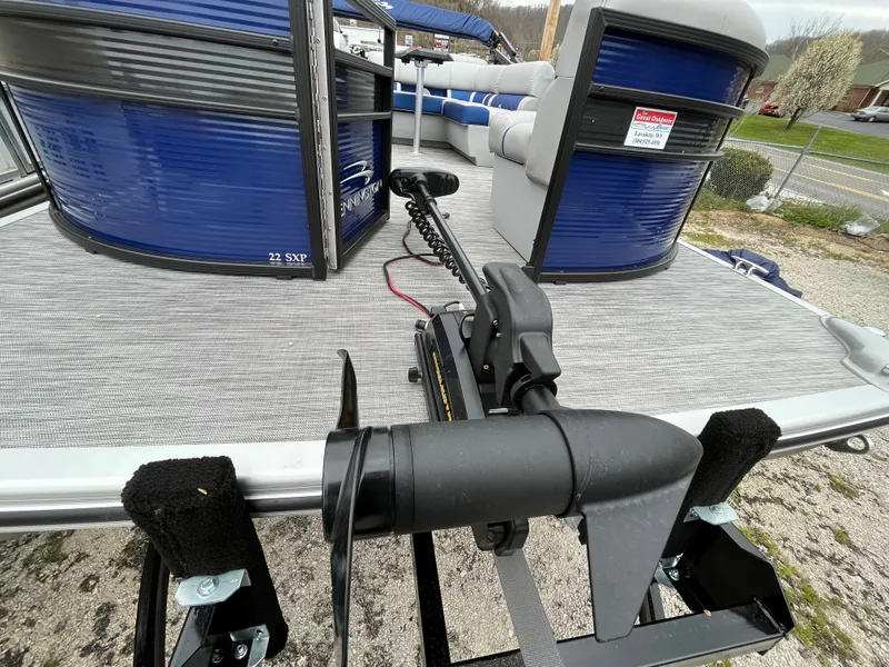 Slide: The Image of 2021 Bennington 22 SSLXP pontoon boat with blue exterior and motor mount. - 6