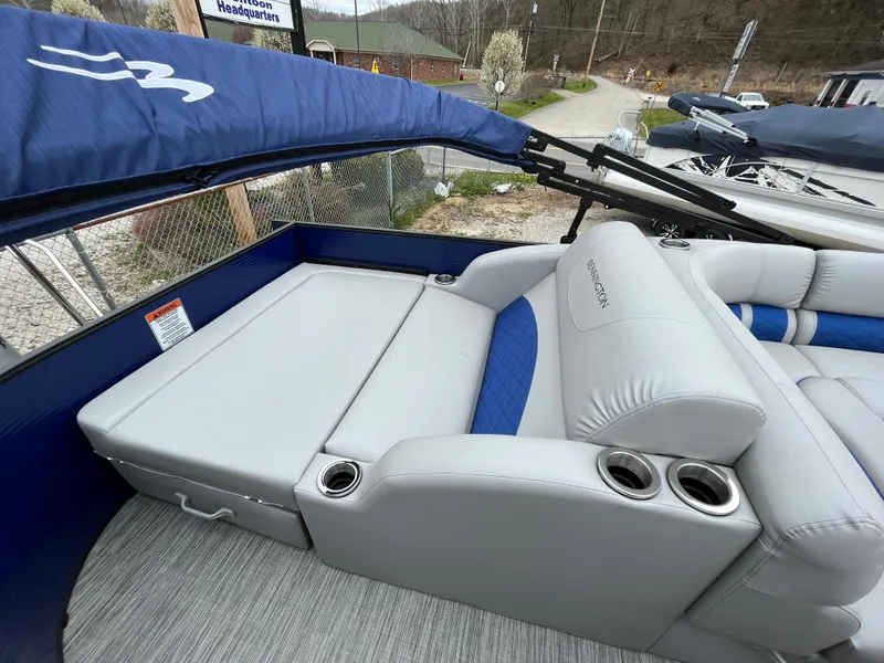 Slide: The Image of 2021 Bennington 22 SSLXP boat interior with gray and blue seating. - 9