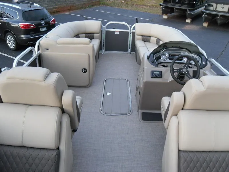 Slide: The Image of 2023 Sun Tracker PARTY BARGE® 22 XP3 interior with plush seating and modern dashboard. - 13