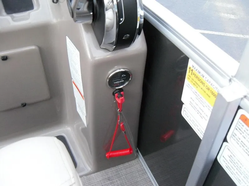 Slide: The Image of 2023 Sun Tracker PARTY BARGE® 22 XP3 control panel with safety lanyard and ignition switch. - 36