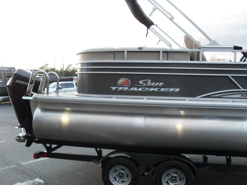 Slide: The Image of 2023 Sun Tracker PARTY BARGE® 22 XP3 pontoon boat on trailer. - 5