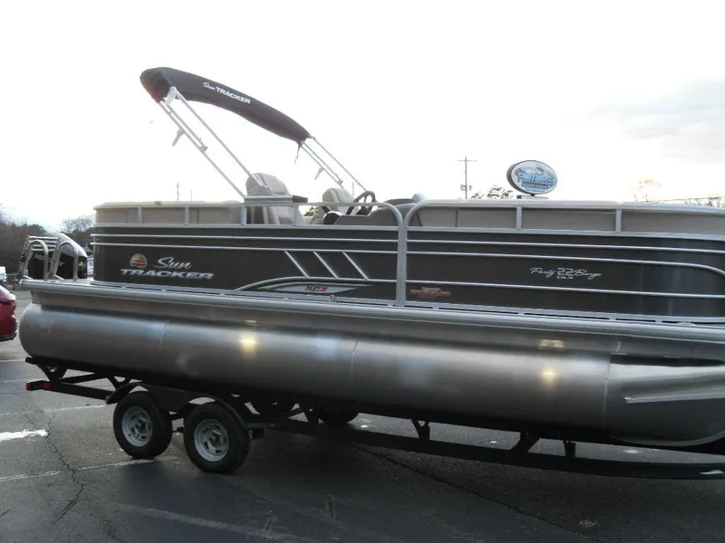 Slide: The Image of 2023 Sun Tracker PARTY BARGE® 22 XP3 pontoon boat on trailer. - 6
