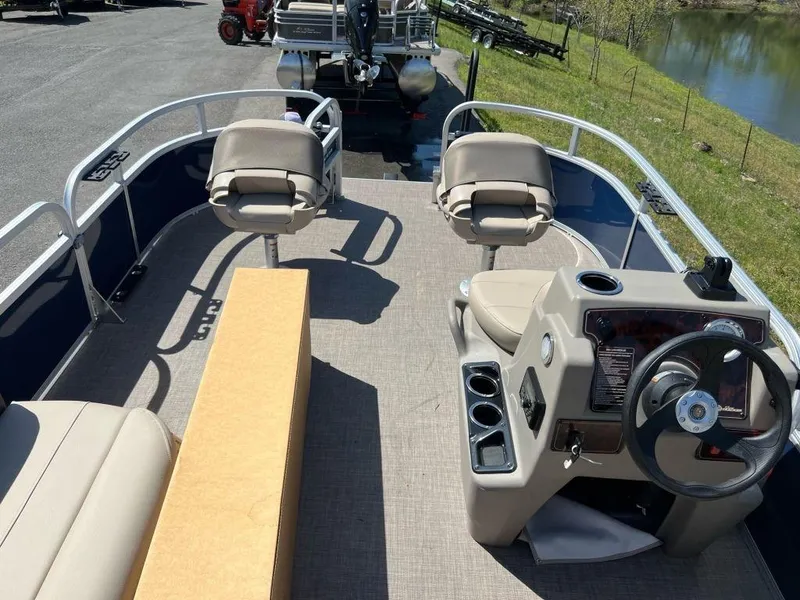 Slide: The Image of 2023 Sun Tracker Bass Buggy® 16 XL Select pontoon boat interior with seating and steering console. - 3
