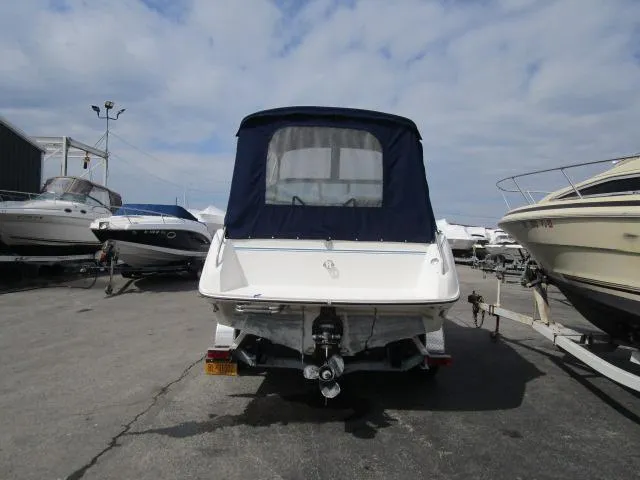 Slide: The Image of 1989 Sea Ray 230 Cuddy boat, rear view, docked at marina. - 4