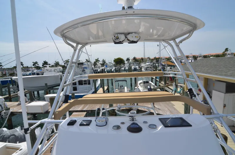 Slide: The Image of 1993 Gamefisherman Open boat in harbor, helm view. - 11