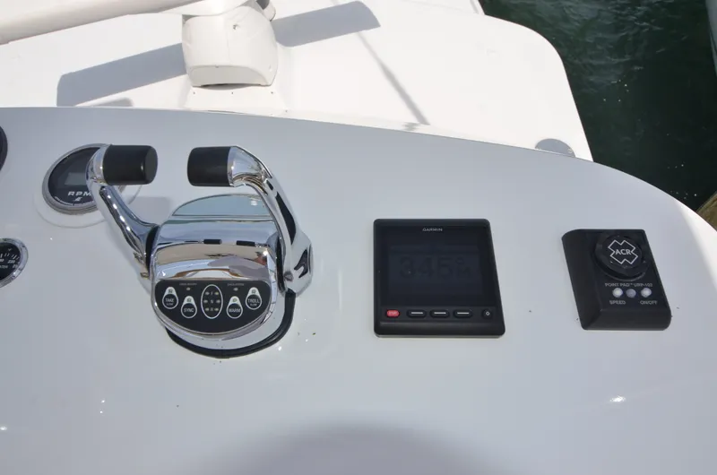 Slide: The Image of 1993 Gamefisherman Open helm with Garmin display and controls. - 12