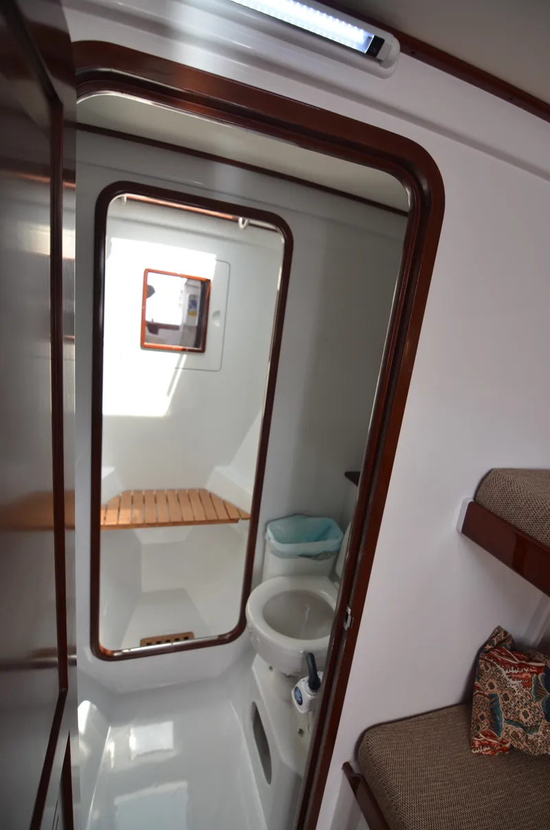 Slide: The Image of Interior of a 1993 Gamefisherman Open yacht with toilet. - 15