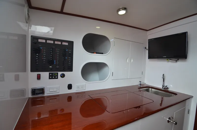 Slide: The Image of Interior of 1993 Gamefisherman Open with wood countertop and control panel. - 17