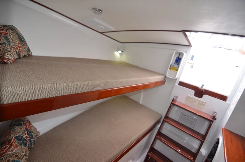 Slide: The Image of Interior of a 1993 Gamefisherman Open with bunk beds. - 19